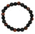 Round beaded bracelet with black and brown stones on a white background