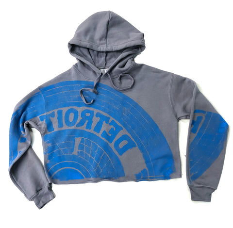 Manhole Cover Women's Cropped Pullover Hoodie, Detroit Tire Print. Honolulu Blue on Grey - Football Inspired!