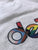 Detroit Pride V-Neck T-Shirt. Rhythm & Progress Rainbow Flag white shirt