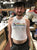 Detroit Pride Cropped Raw Edge Racerback Tank Top, White. Rhythm & Progress Rainbow Flag Tank
