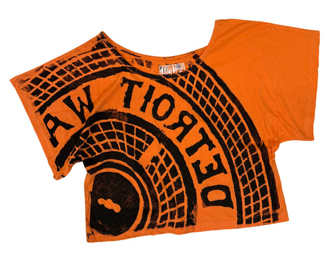 Manhole Cover Women's Crop Top. Detroit Tire Print, Orange