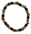 Beaded bracelet with black, brown, and gray beads on a white background