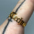 Detroit Techno Adjustable Ring, Gold. Old English Script