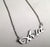 Acid script nameplate necklace, silver. By well done goods