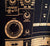 TR-808 Drum Machine T-Shirt, orange on black. Well Done Goods by Cyberoptix