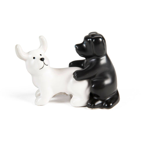 Black and white ceramic dog-shaped salt and pepper shakers on a white background