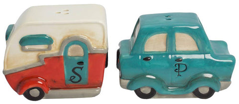 Two ceramic salt and pepper shakers shaped like a camper and a car on a white background