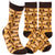 Two socks with a leaf pattern and text on a white background. Text  on socks reads "Have a nice fucking day."