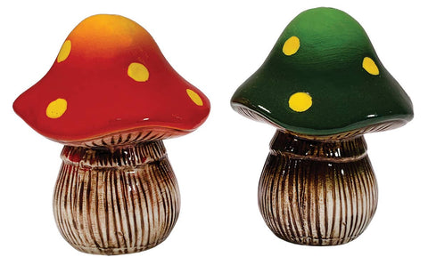 Two ceramic mushroom figurines, one red and one green, on a white background.
