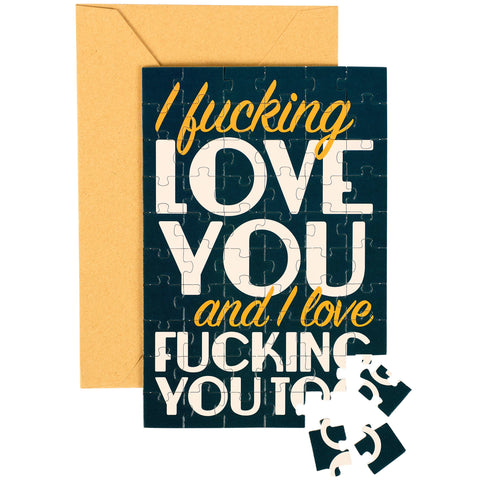 Jigsaw puzzle with text 'I fucking love you and I love fucking you too' on a card with an envelope.