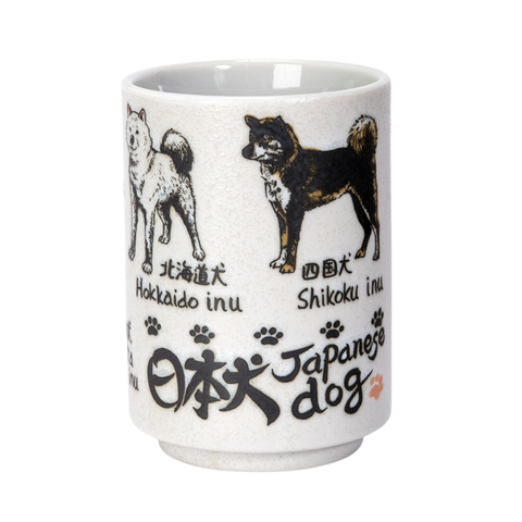 Yunomi style tea cup with illustrated japanese dog breeds on a white background.