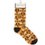 Sock with leaf design on a white background. Text  on socks reads "Have a nice fucking day."