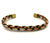 A braided metal cuff bracelet with alternating bronze, gold, and silver-toned links, shown on a plain white background.
