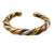 A twisted three-metal cuff bracelet featuring alternating segments of gold, silver, and rose gold with a braided rope detail running along the center, shown on a plain white background.