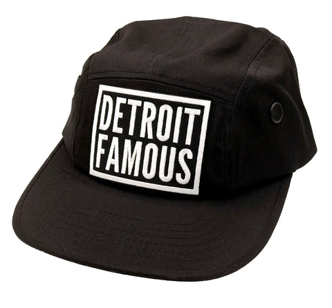 Black 5-panel cap with 'Detroit Famous' text on a white background