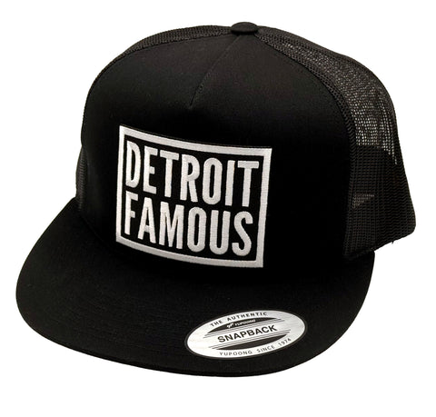 Black trucker cap with 'Detroit Famous' logo on a white background