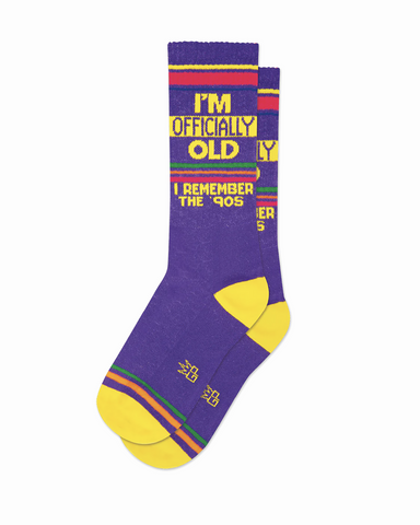 purple socks with yellow text reading im officially old i remember the 90s gym socks by parquet 