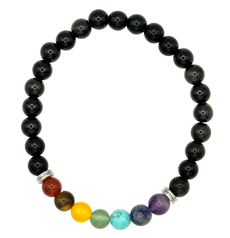 A beaded stretch bracelet featuring a row of polished black round beads with a section of seven colorful chakra beads (yellow, green, light blue, purple, dark blue, brown, and red) separated by small silver spacer rings, shown on a plain white background.