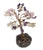 Crystal tree with chips of amethyst, opalite and rose quartz on a base made of raw amethyst . 
