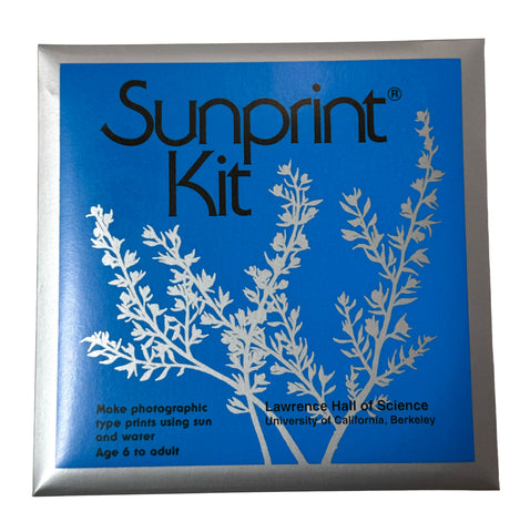 Sunprint Kit box featuring a bright blue front cover with white botanical illustrations and black text, framed by a metallic silver border.