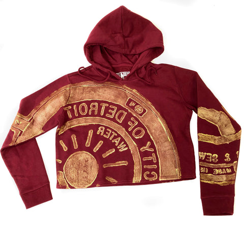 Manhole Cover Women's Cropped Hoodie, Spirit of Detroit. Burgundy & Gold. LIMITED EDITION