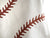 Baseball Stitching Baby Onesie detail, rust print on white. Well Done Goods