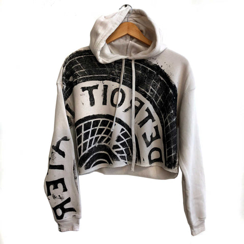 Manhole Cover Women's Cropped Pullover Hoodie, Detroit Tire Print. Black on Heather Dust